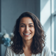 Portrait of a smiling young woman with an energetic and satisfied expression, conveying trust and happiness.